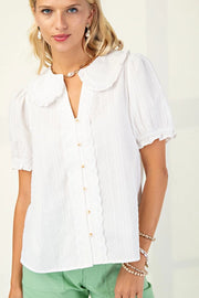 Dainty button up top