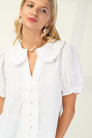 Dainty button up top