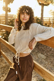 Cable Knit Drawstring Bottom Sweater